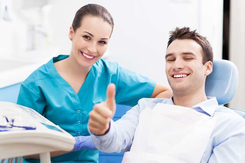 Doctor with Happy Patient in Clinic
